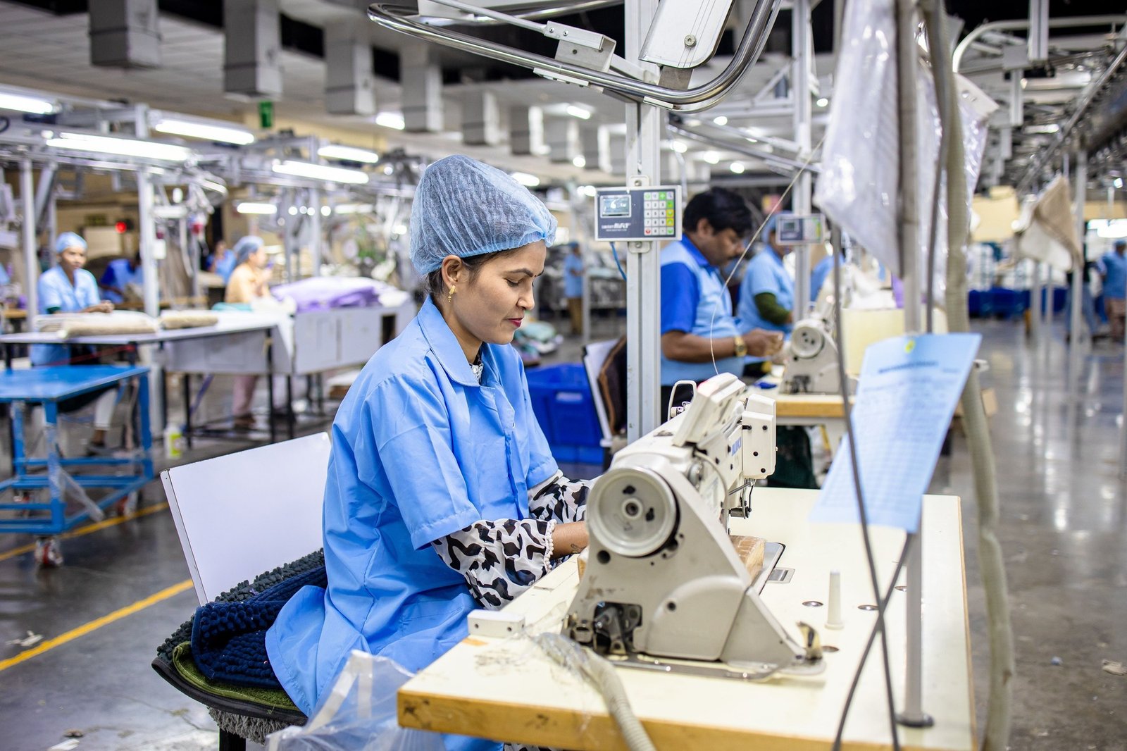 Production floor with garment workers at sewing stations